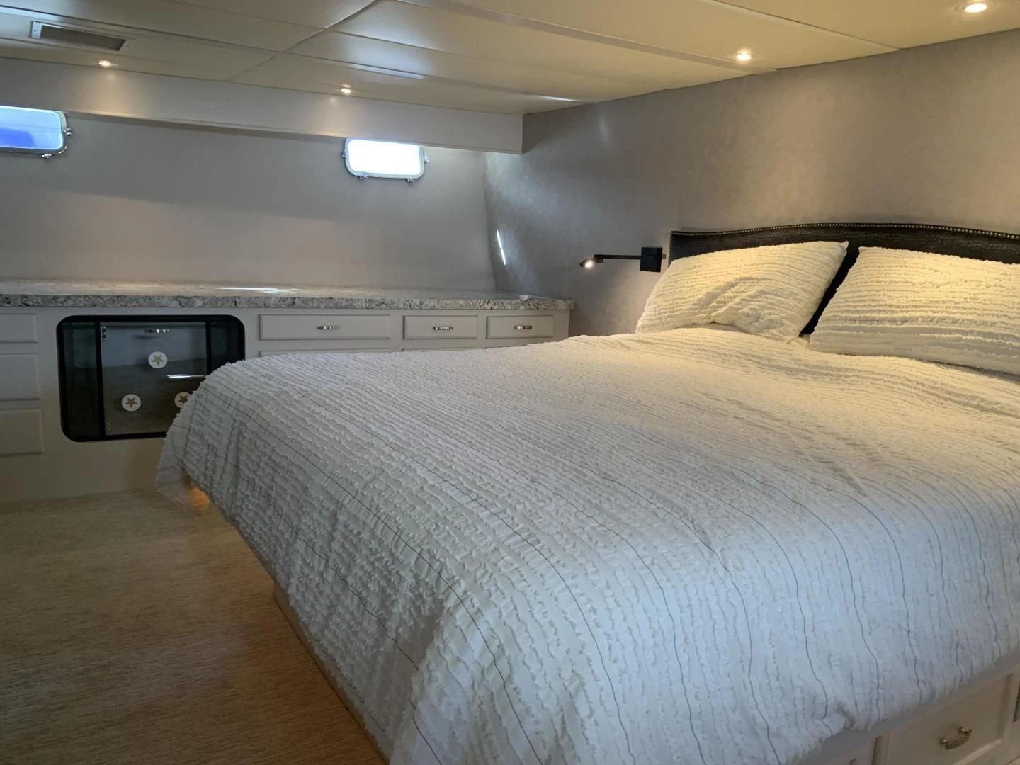 a bed with a television on top aboard WHISKEY DAWN Yacht for Sale