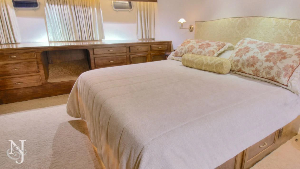 a bed with a white sheet aboard WHISKEY DAWN Yacht for Sale