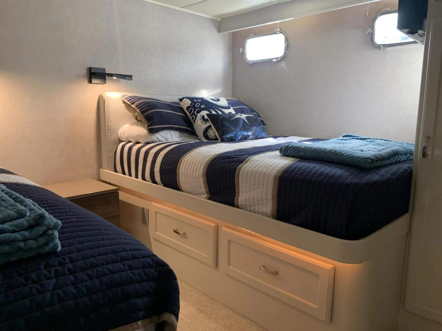 a bedroom with a bed and a desk aboard WHISKEY DAWN Yacht for Sale