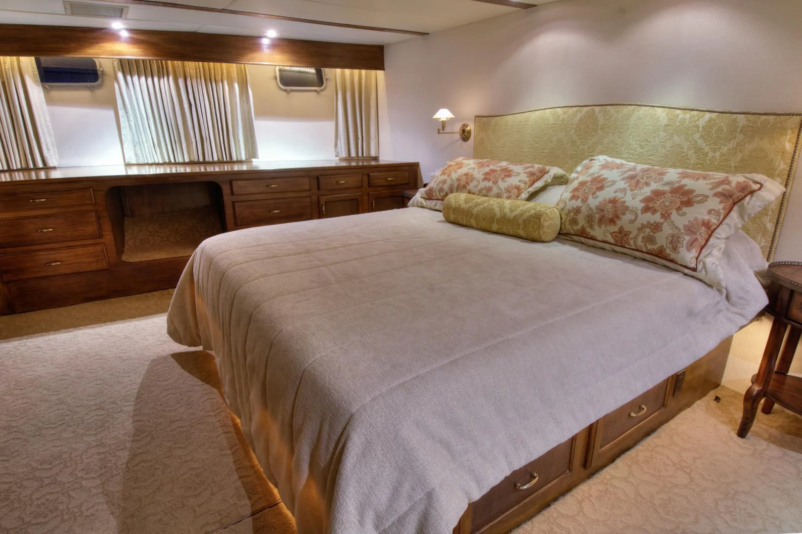 a bedroom with a bed and a desk aboard WHISKEY DAWN Yacht for Sale