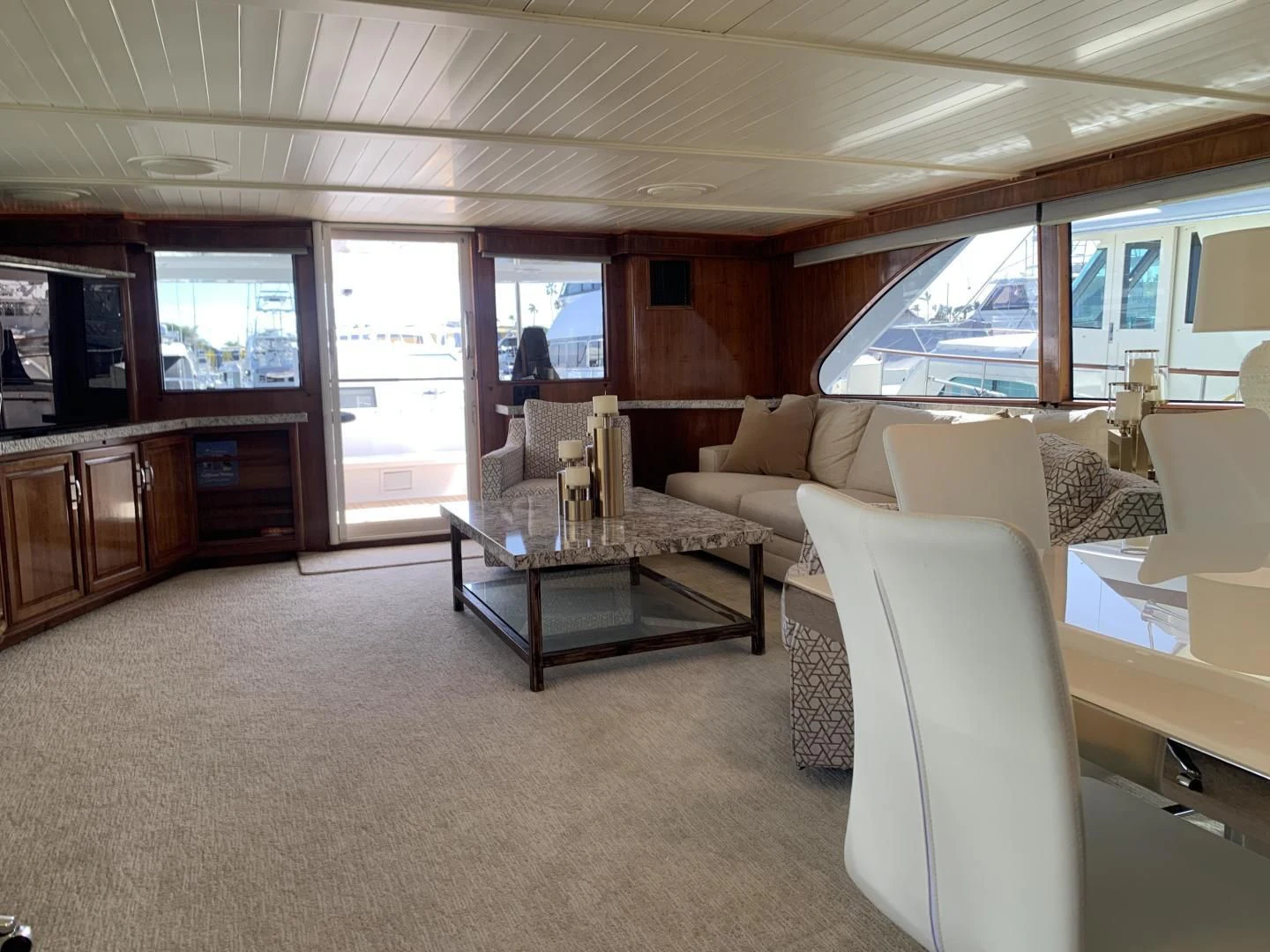 a living room with a couch and a coffee table aboard WHISKEY DAWN Yacht for Sale