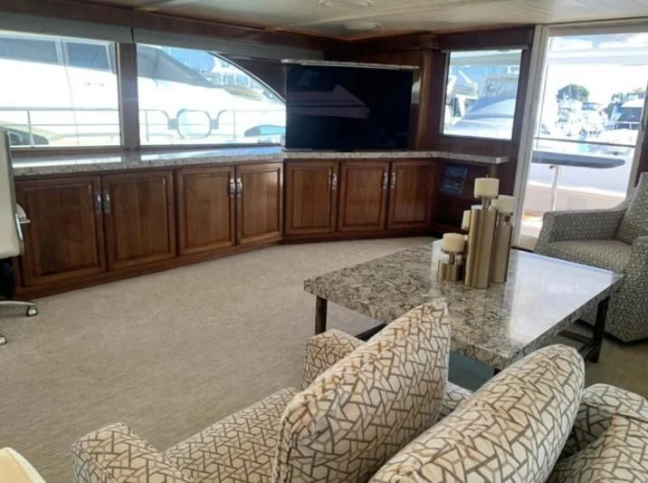 a living room with wood cabinets aboard WHISKEY DAWN Yacht for Sale