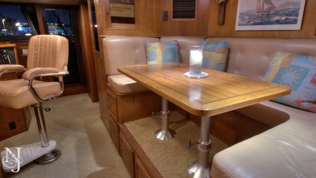 a table with a glass on it aboard WHISKEY DAWN Yacht for Sale