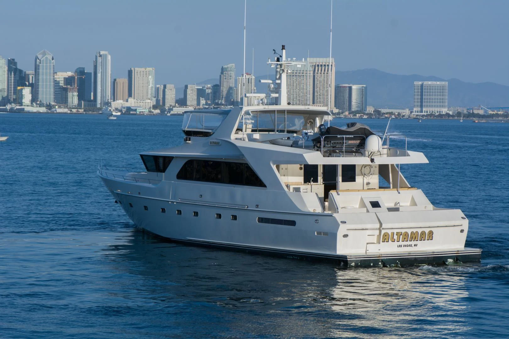 a white yacht in the water aboard WHISKEY DAWN Yacht for Sale