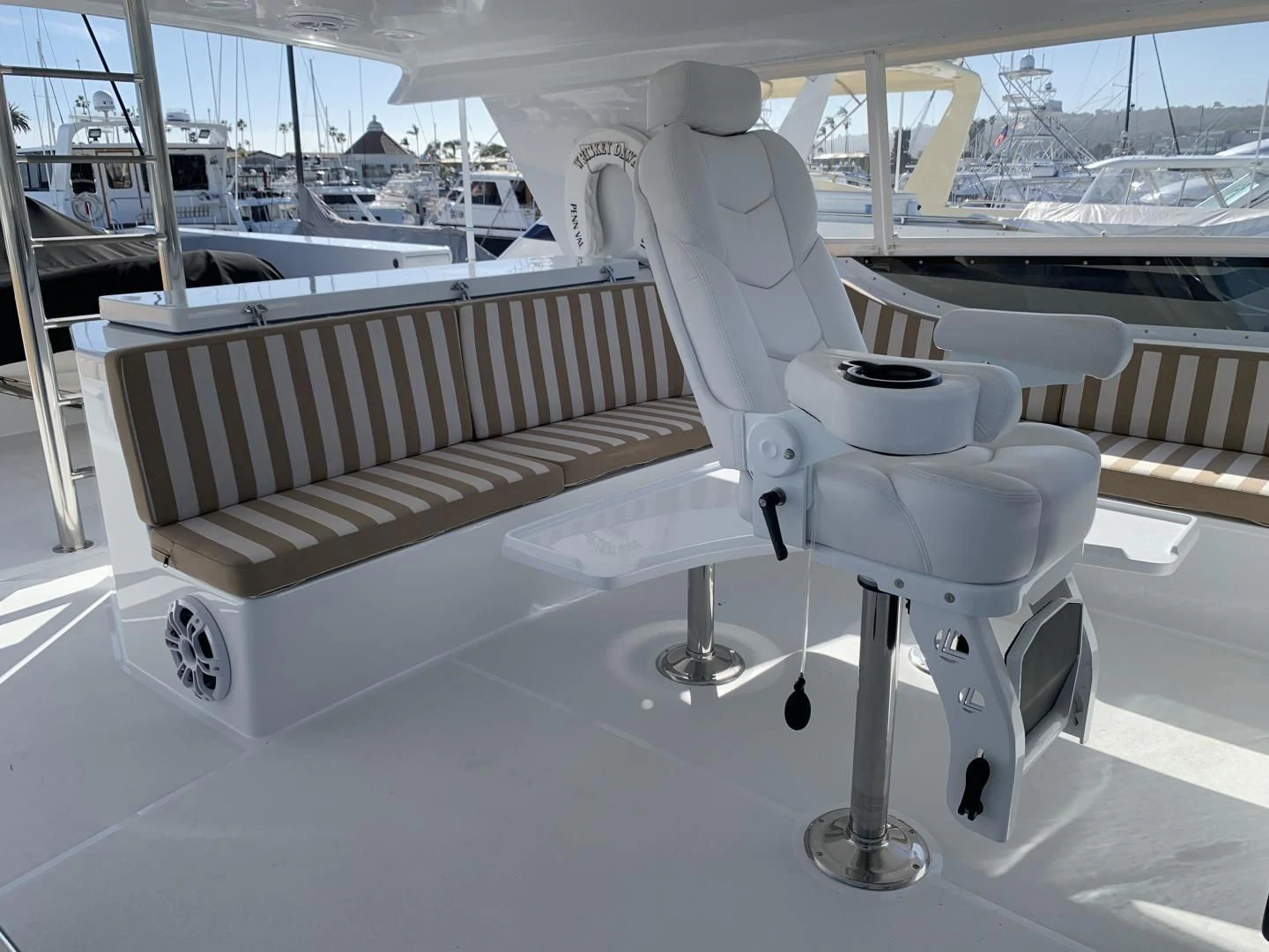 a white chair with a bench in front of it aboard WHISKEY DAWN Yacht for Sale