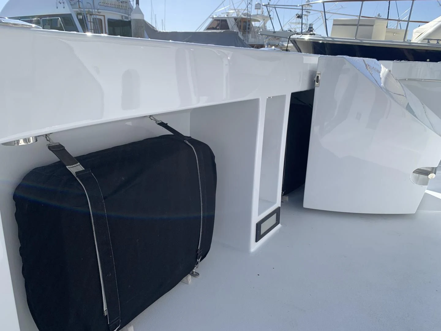 a black suitcase on a white boat aboard WHISKEY DAWN Yacht for Sale