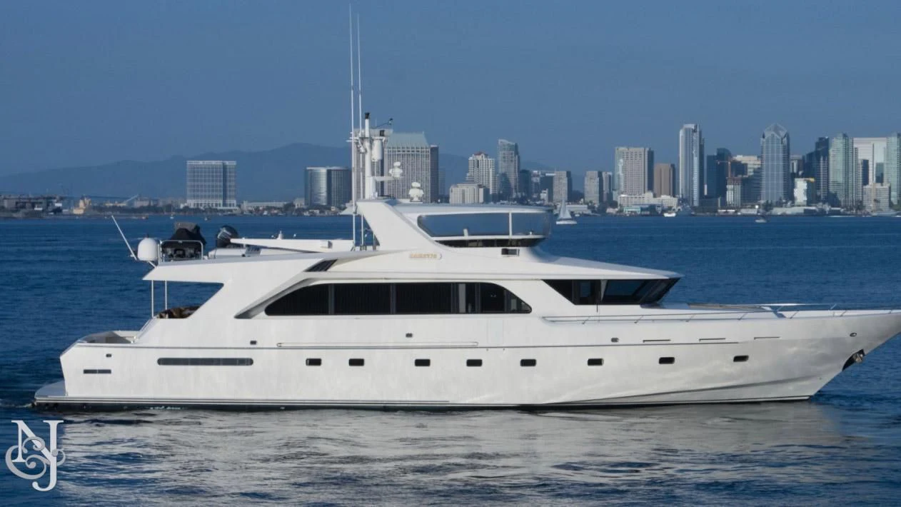 a white yacht in the water aboard WHISKEY DAWN Yacht for Sale