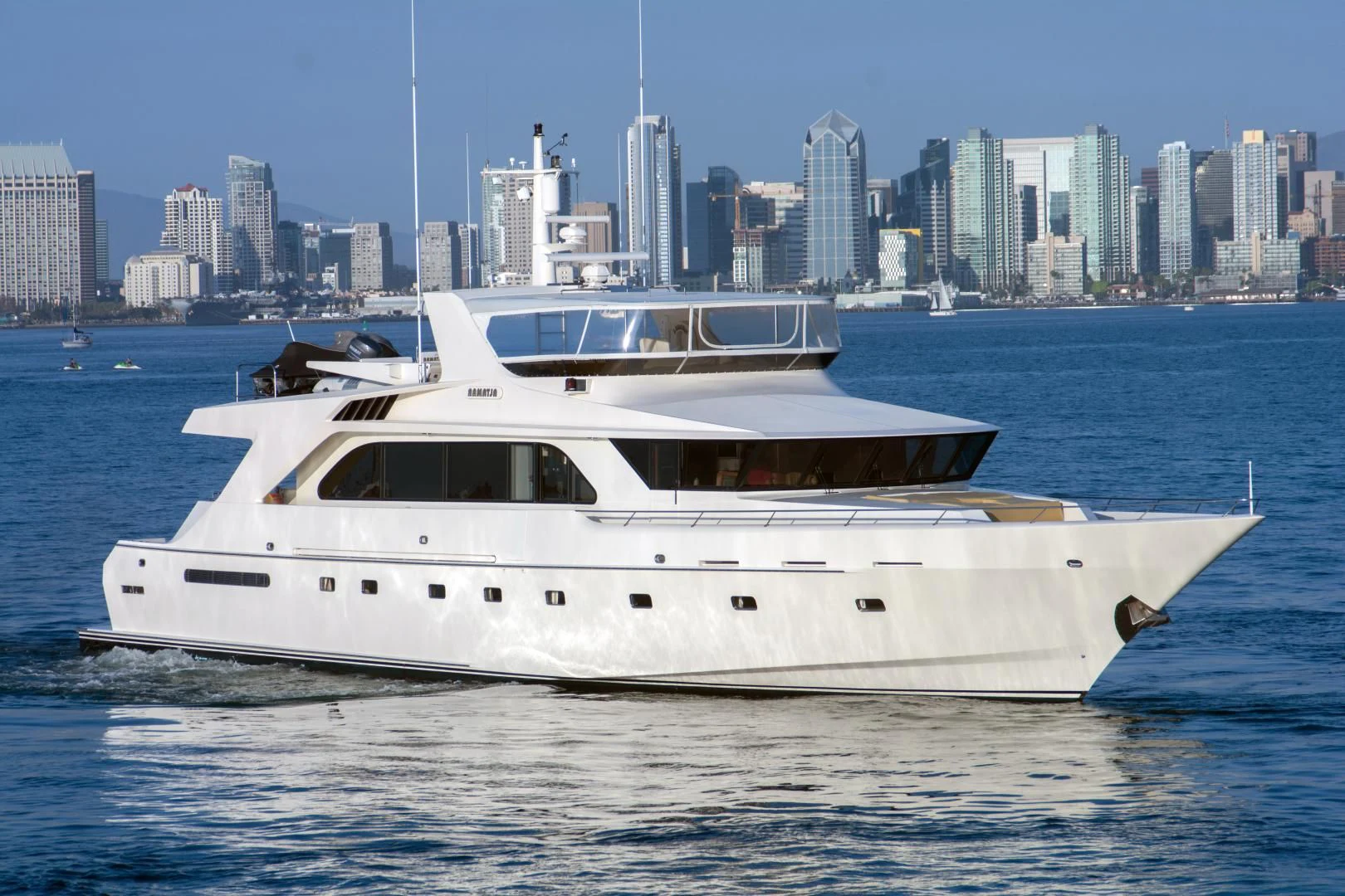 a white yacht in the water aboard WHISKEY DAWN Yacht for Sale
