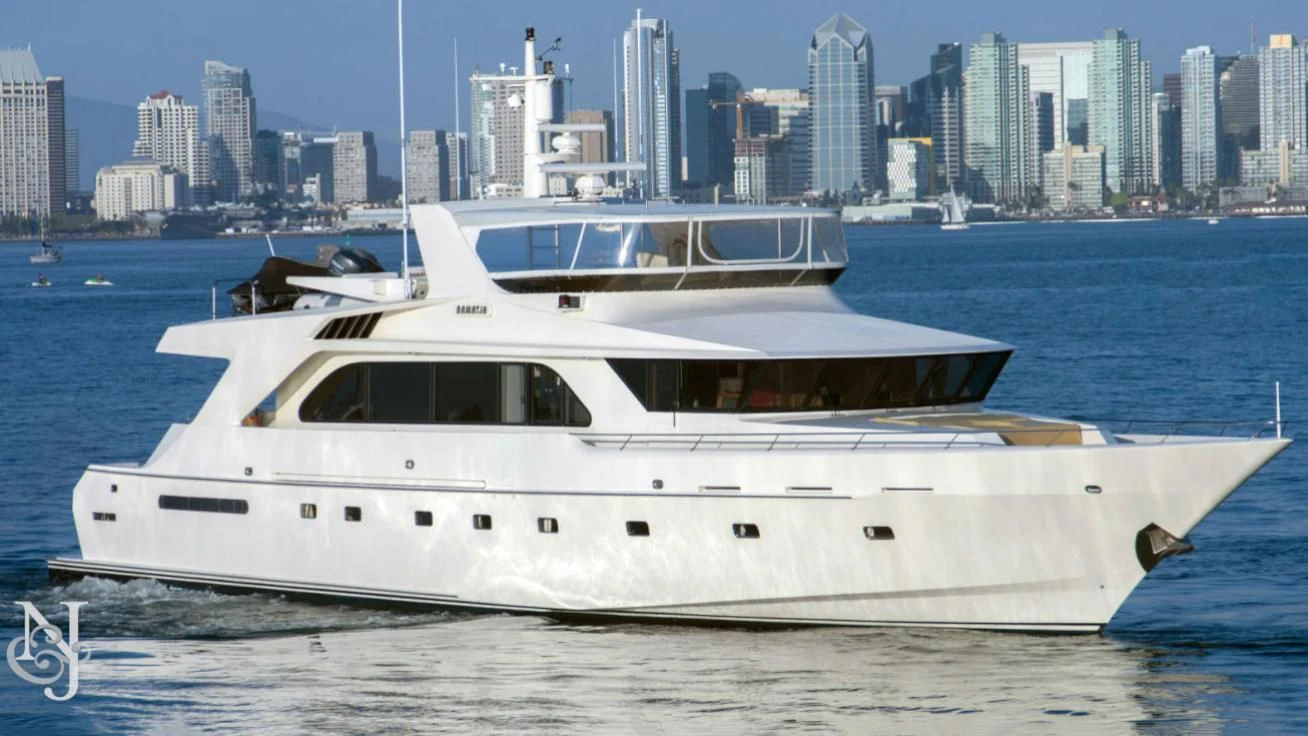 a white yacht in the water aboard WHISKEY DAWN Yacht for Sale