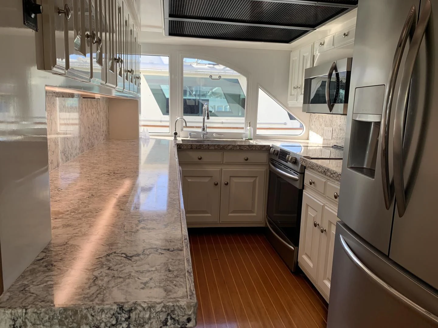 a kitchen with a tile floor aboard WHISKEY DAWN Yacht for Sale