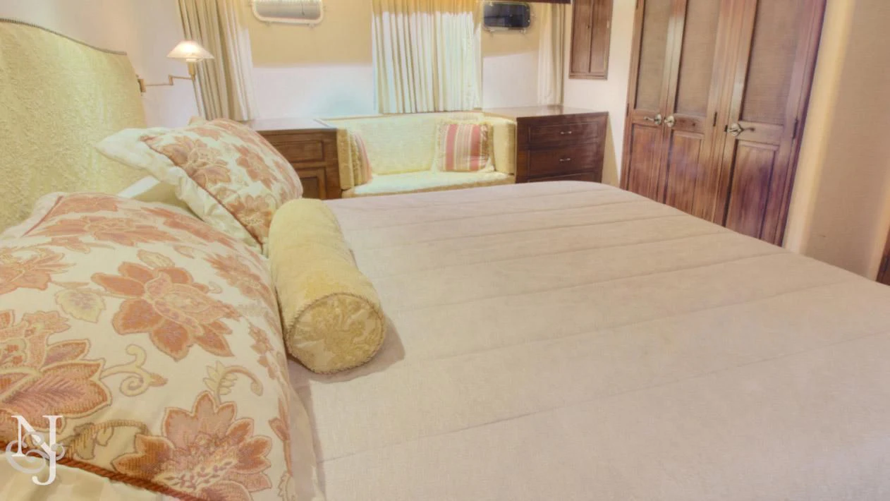 a couple of beds in a hotel room aboard WHISKEY DAWN Yacht for Sale