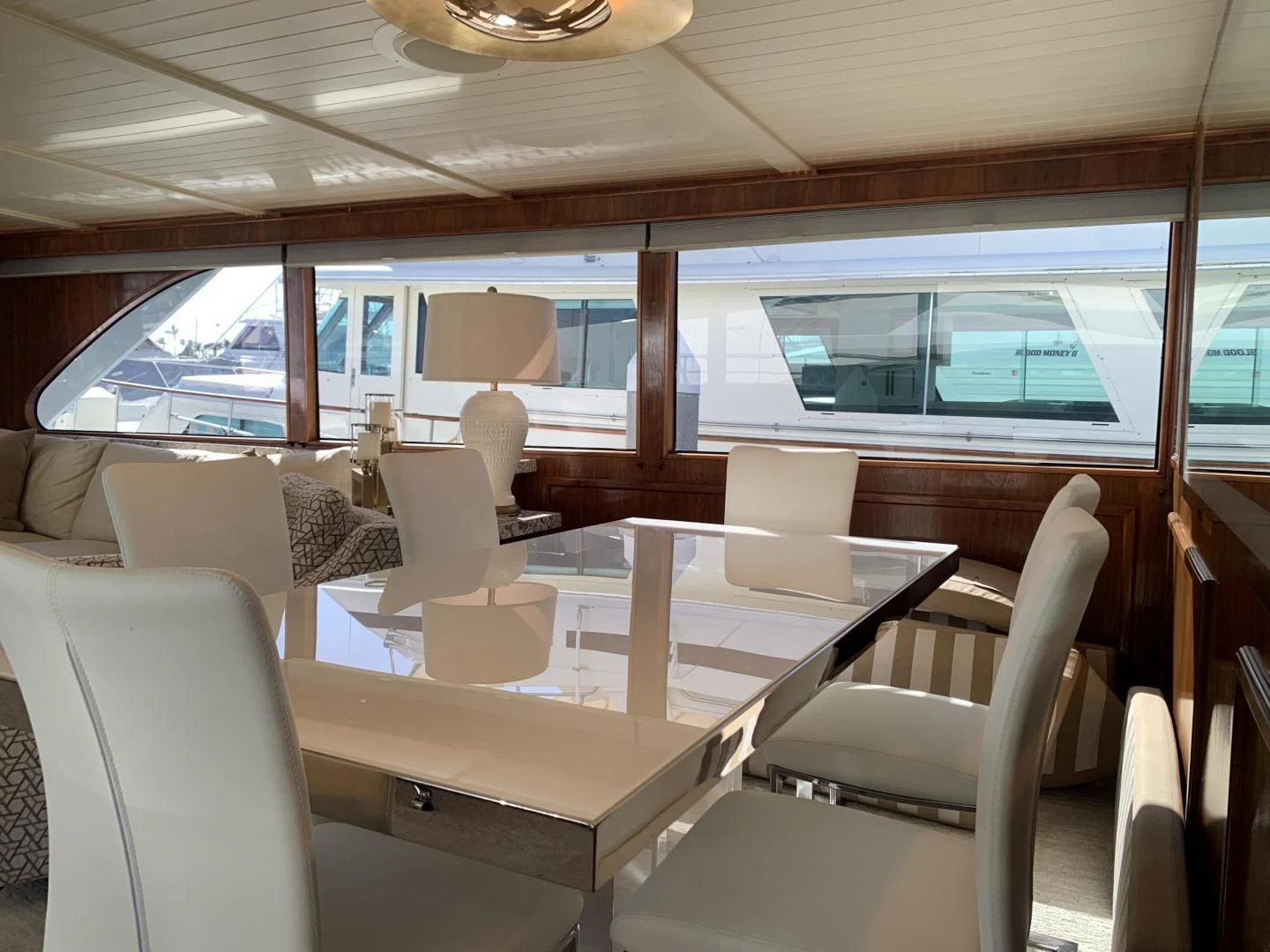a room with a table and chairs aboard WHISKEY DAWN Yacht for Sale