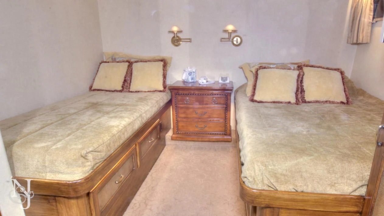 a couple of beds in a hotel room aboard WHISKEY DAWN Yacht for Sale