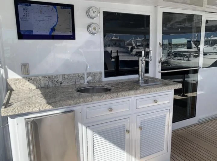 a kitchen with a marble counter top aboard WHISKEY DAWN Yacht for Sale