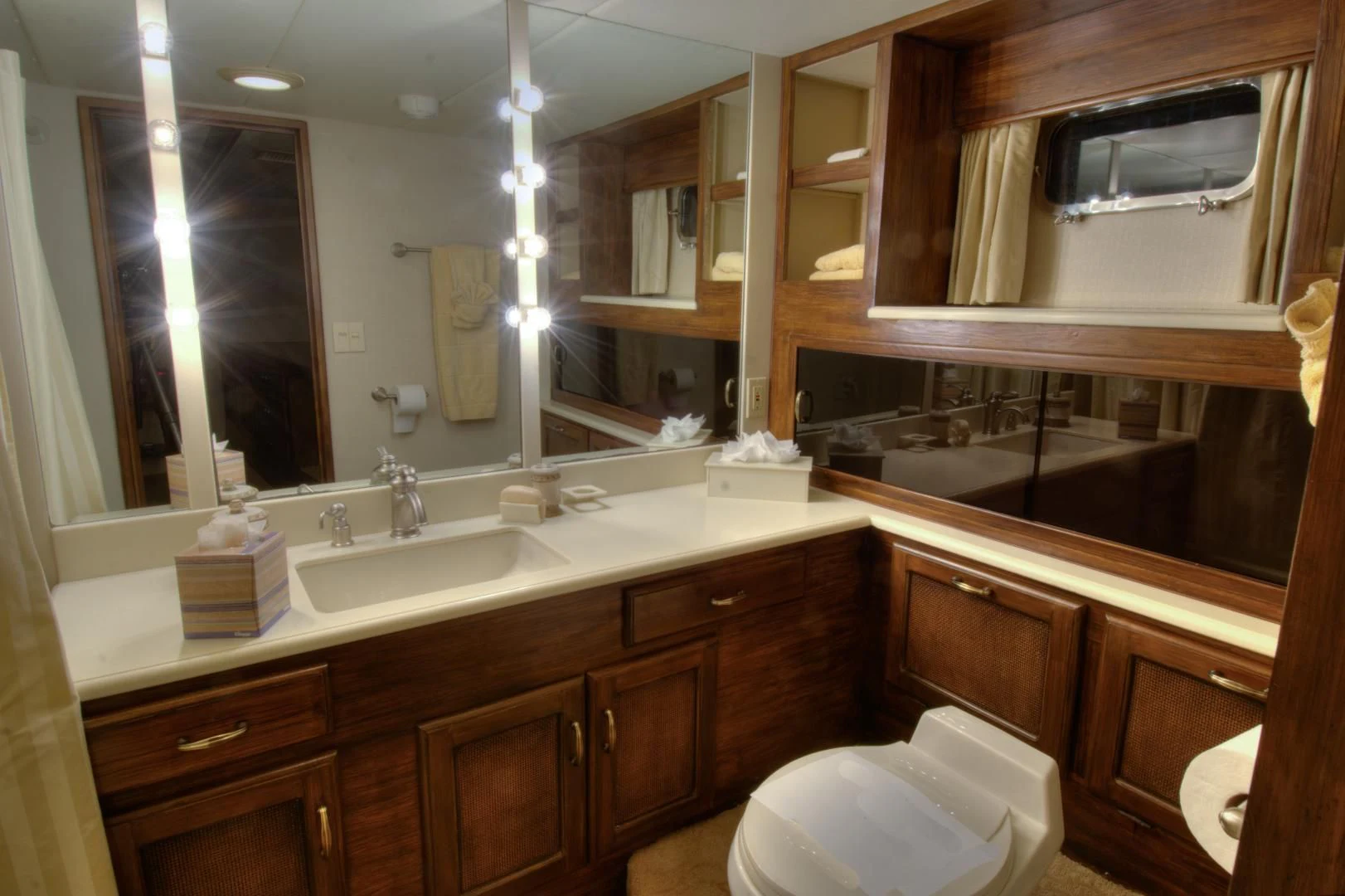 a bathroom with a large mirror aboard WHISKEY DAWN Yacht for Sale