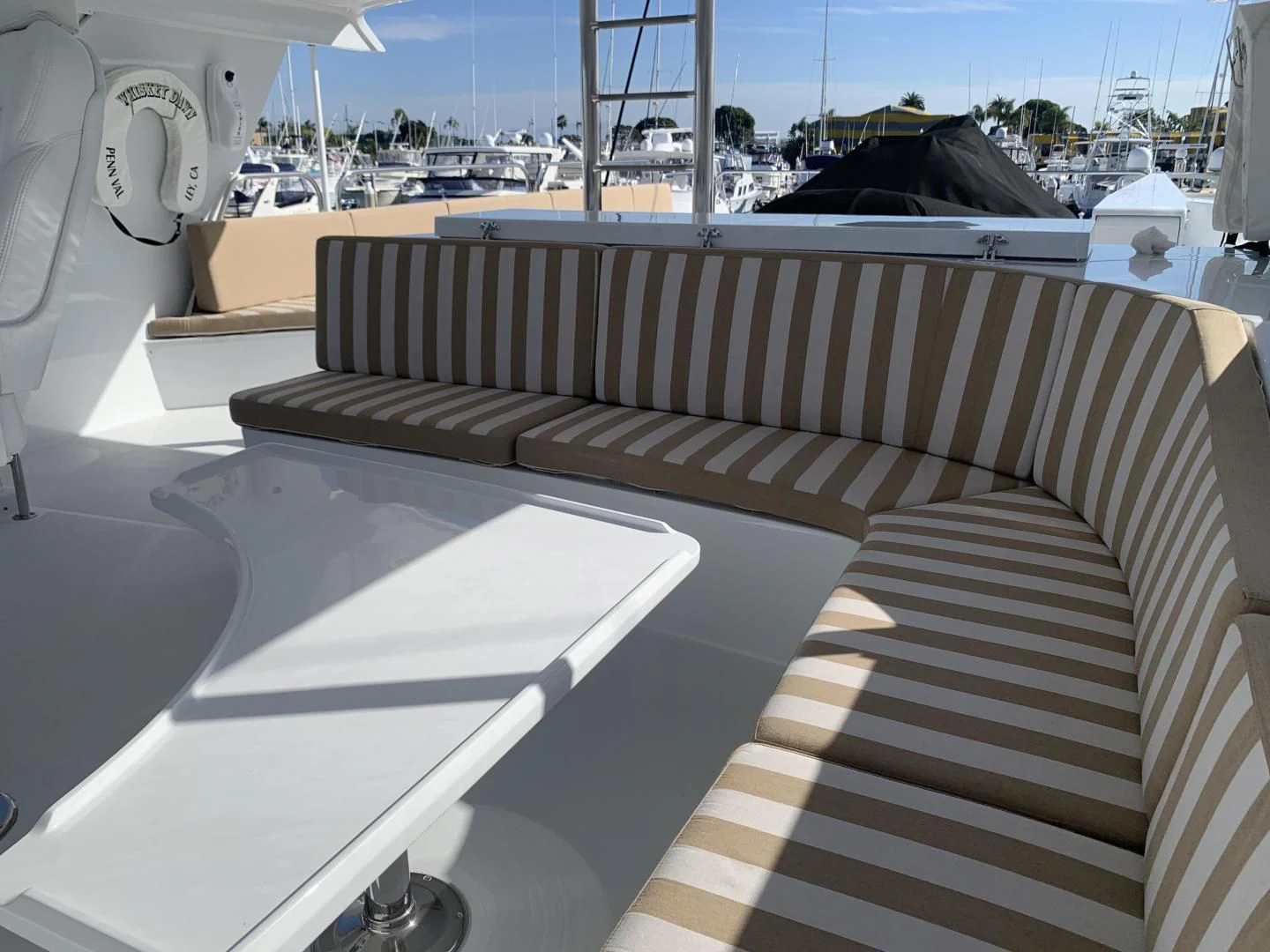 a deck with a deck overlooking a marina aboard WHISKEY DAWN Yacht for Sale