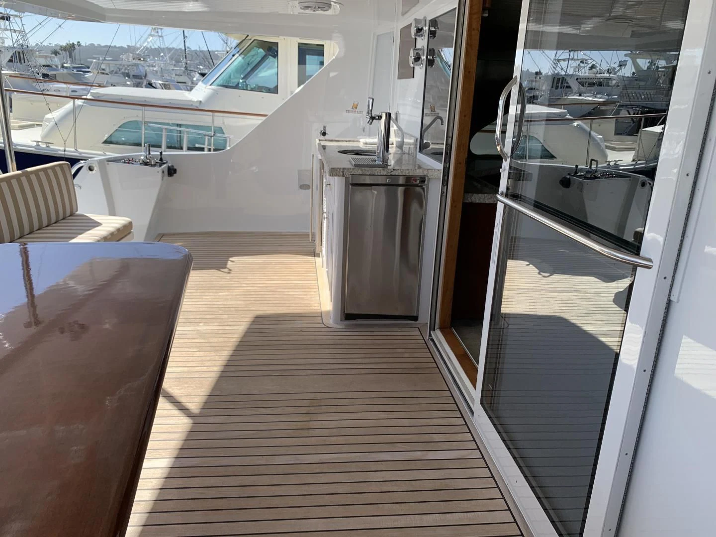 a boat with a wood deck aboard WHISKEY DAWN Yacht for Sale