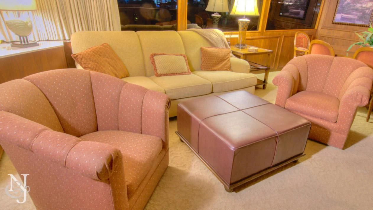 a living room with a couch and a table aboard WHISKEY DAWN Yacht for Sale