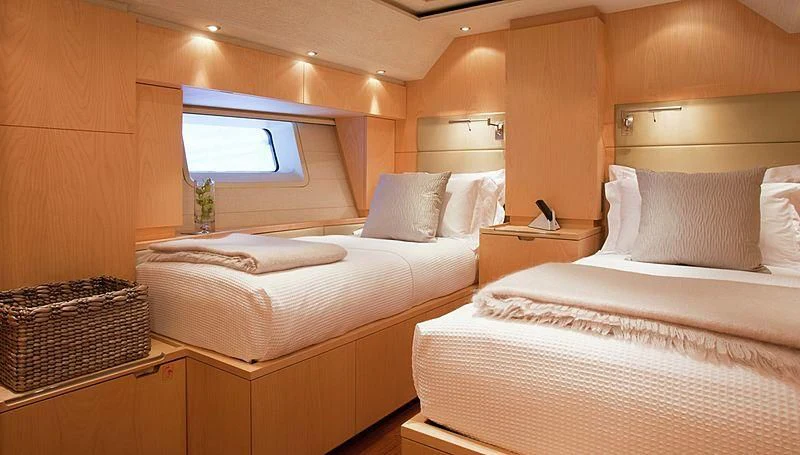 a couple of beds in a room aboard GUILLEMOT Yacht for Sale