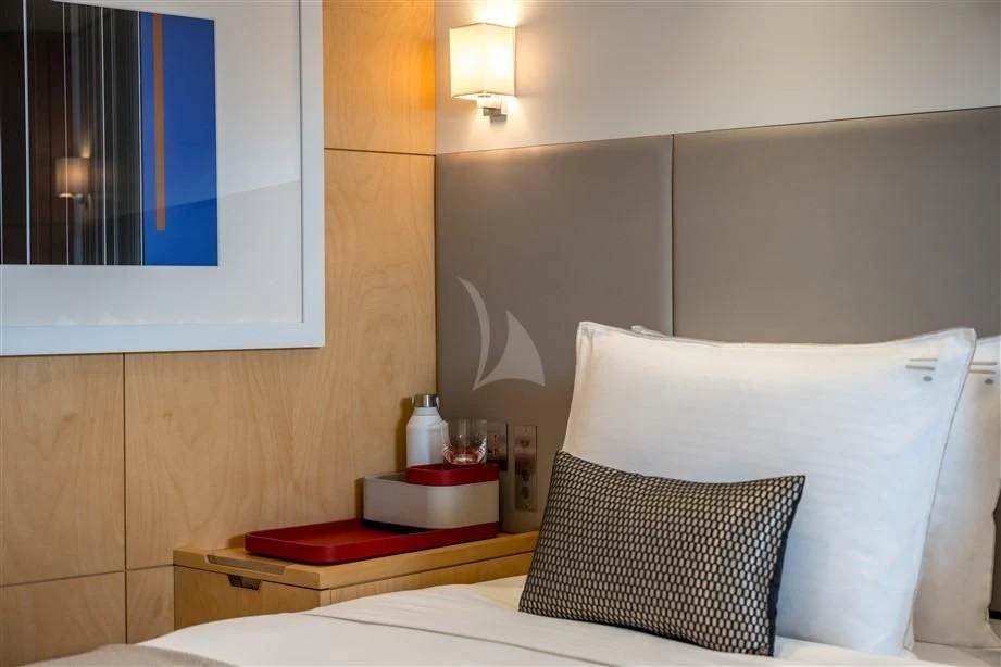 a bed with a white pillow and a white pillow aboard GUILLEMOT Yacht for Sale