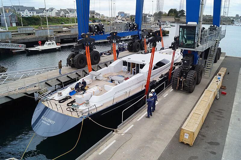 a boat being loaded with cargo aboard GUILLEMOT Yacht for Sale