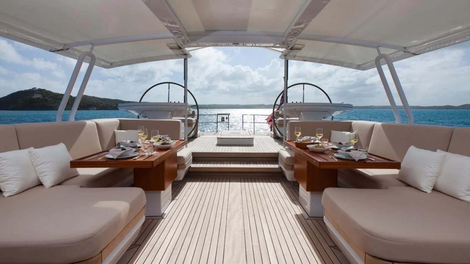 a boat with a table and chairs aboard GUILLEMOT Yacht for Sale