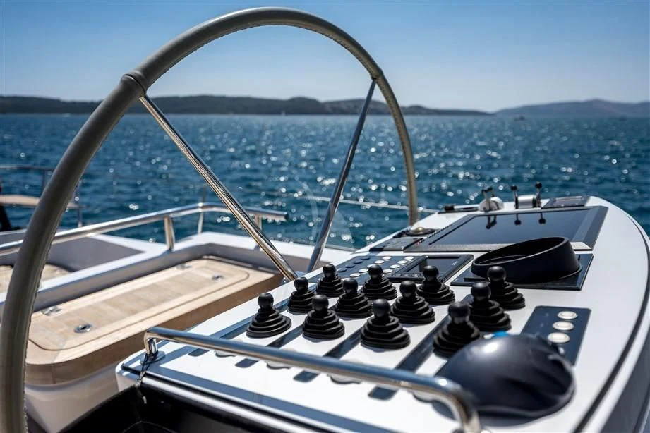 a boat with a steering wheel aboard GUILLEMOT Yacht for Sale
