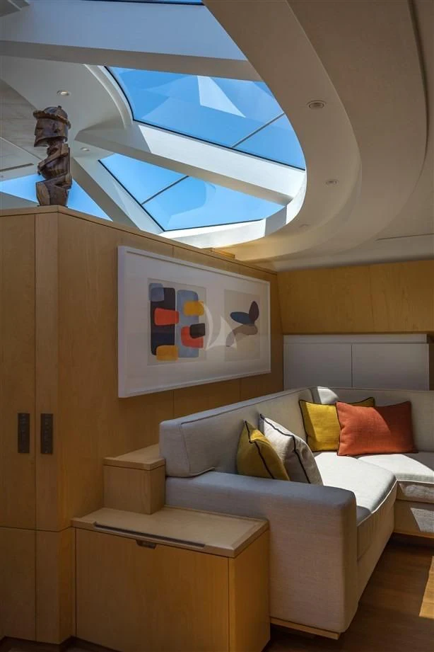 a room with a bed and a large window aboard GUILLEMOT Yacht for Sale