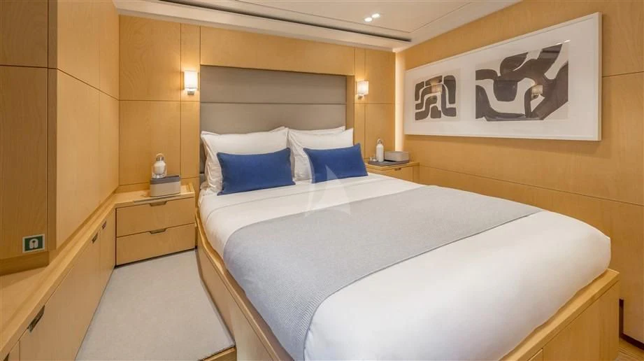 a room with a bed and a desk aboard GUILLEMOT Yacht for Sale