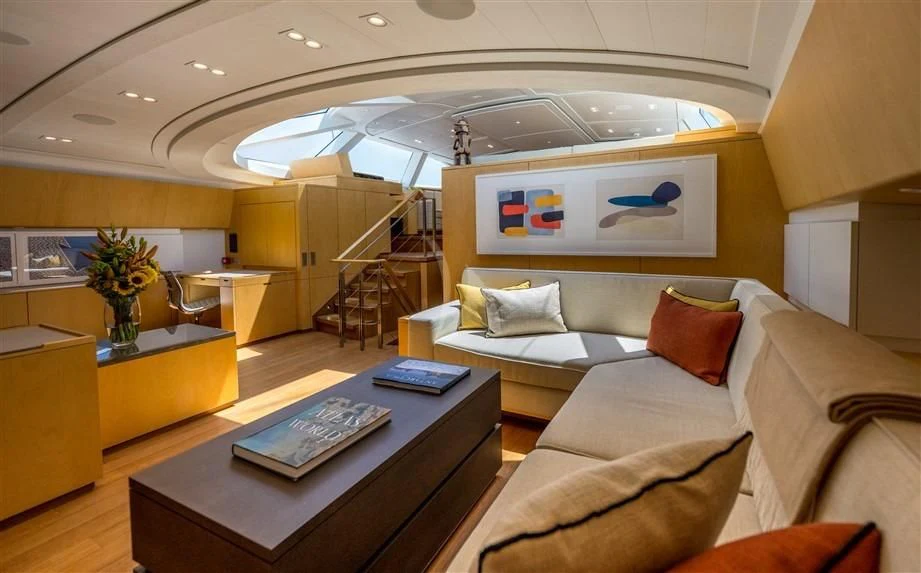 a living room with a large ceiling fan aboard GUILLEMOT Yacht for Sale