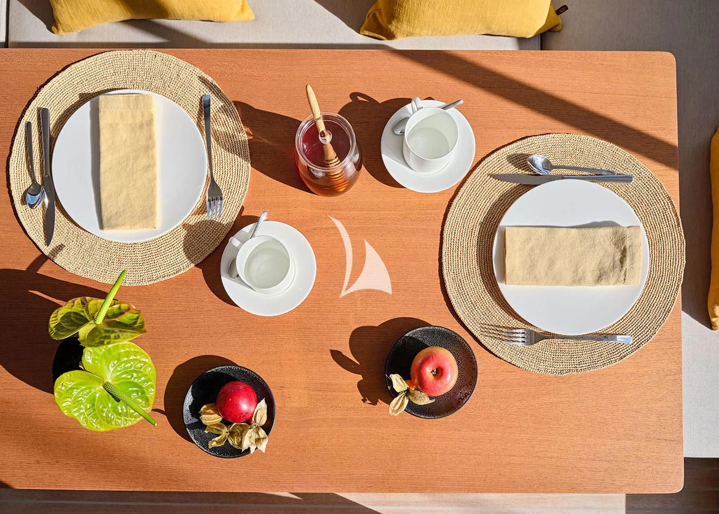 a table with plates and cups aboard GUILLEMOT Yacht for Sale