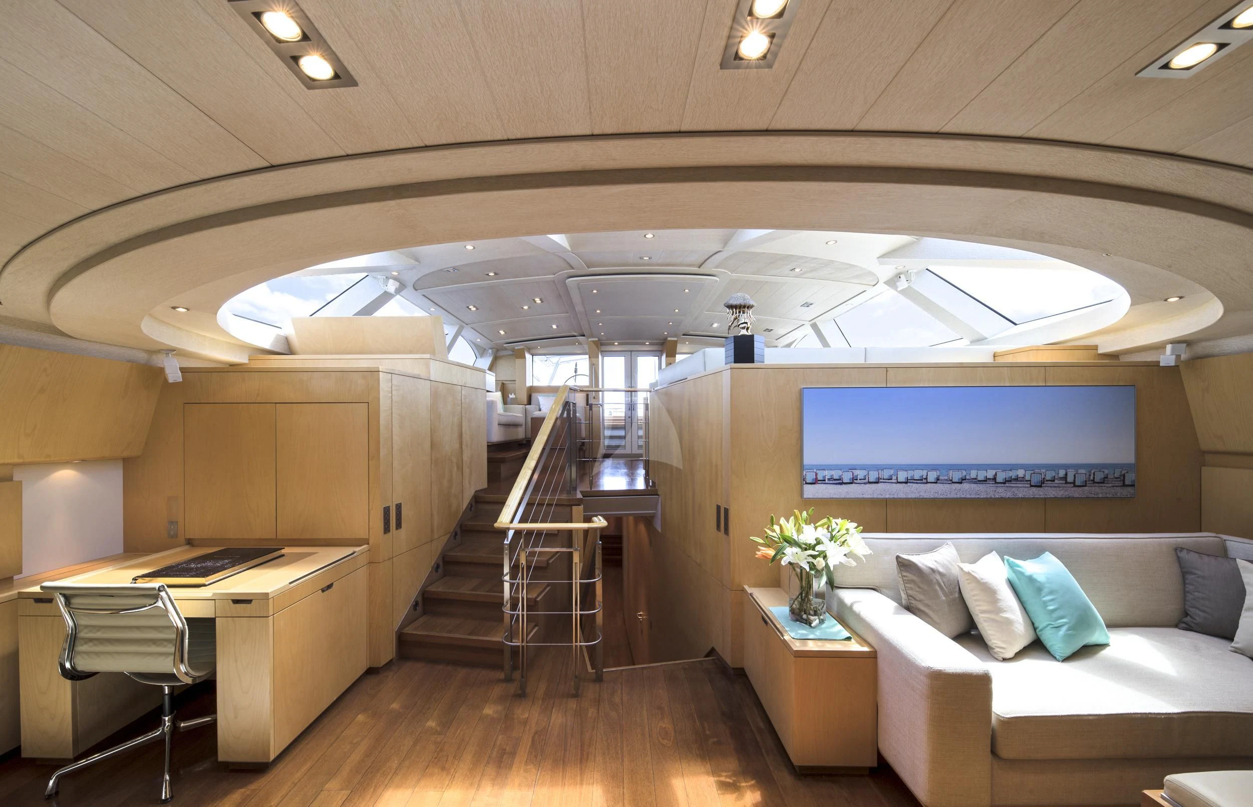 a room with a couch and a table and a tv aboard GUILLEMOT Yacht for Sale