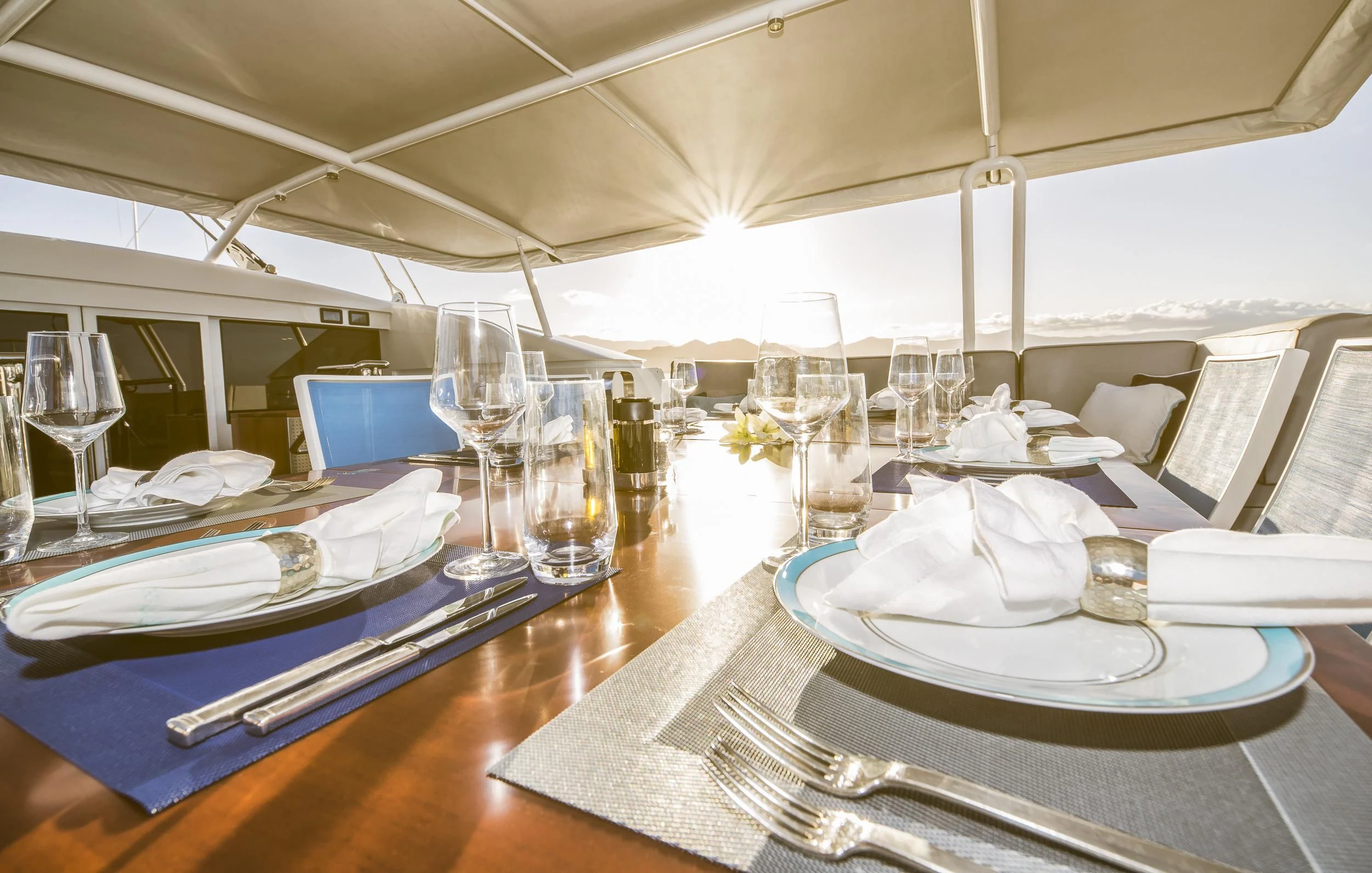 a table set with place settings aboard GUILLEMOT Yacht for Sale