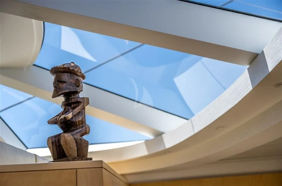 a statue of a person on a staircase aboard GUILLEMOT Yacht for Sale