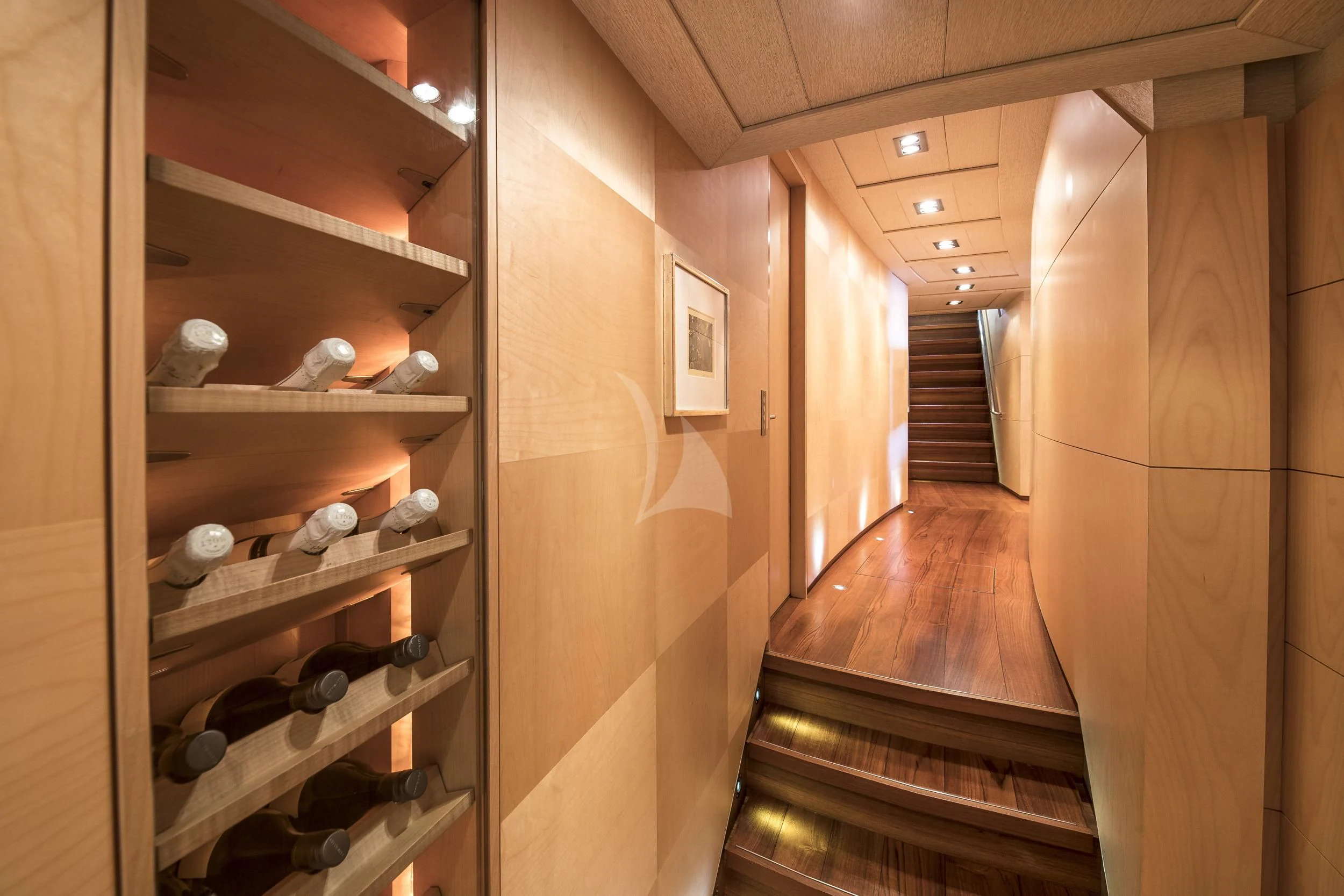 a room with wooden shelves aboard GUILLEMOT Yacht for Sale