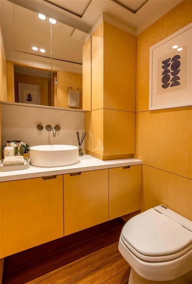 a bathroom with a sink and toilet aboard GUILLEMOT Yacht for Sale