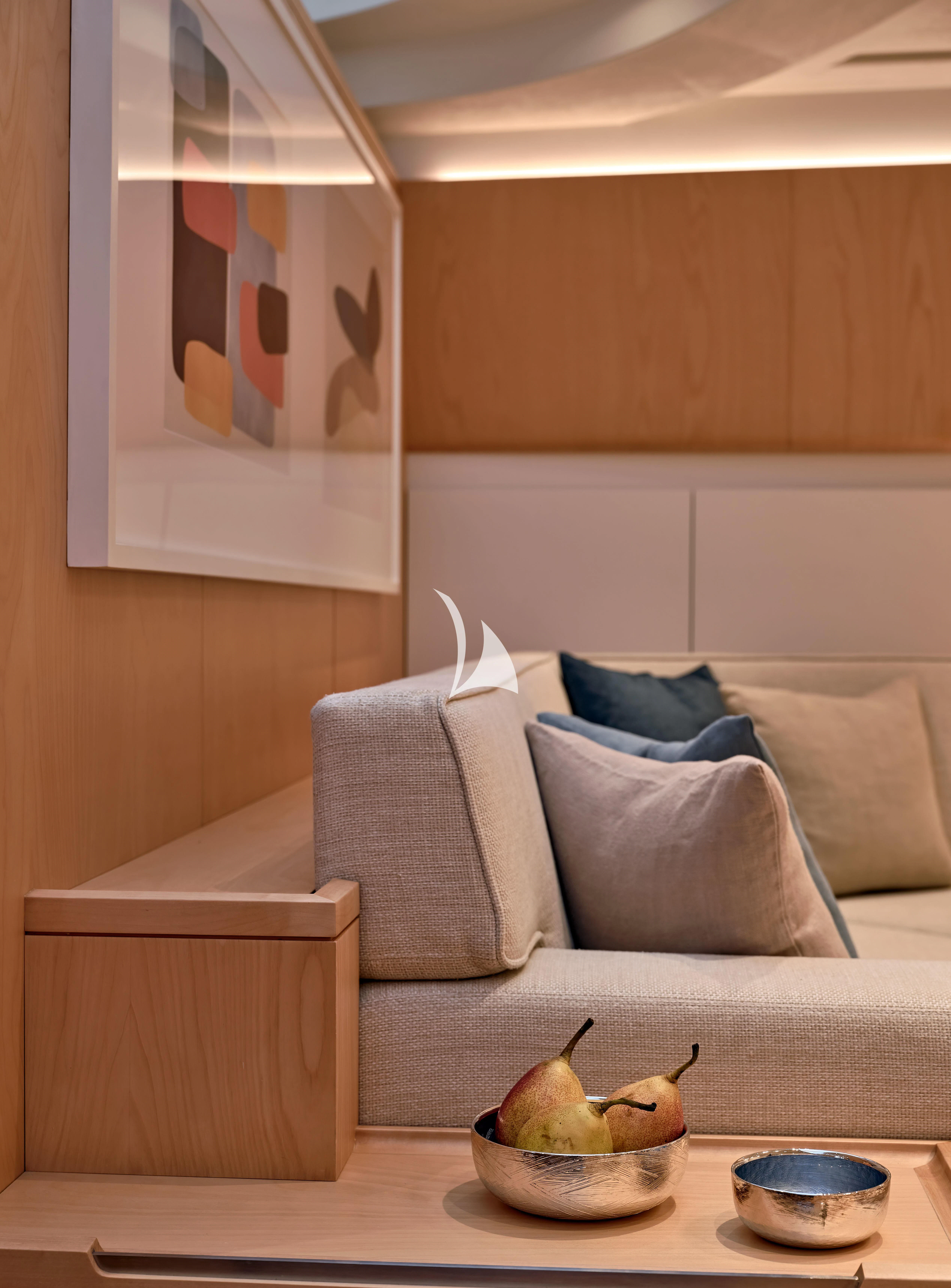 a room with a couch and a coffee table aboard GUILLEMOT Yacht for Sale