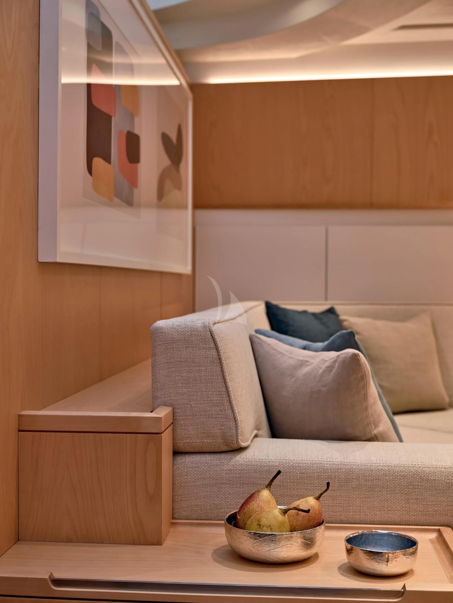 a room with a couch and a coffee table aboard GUILLEMOT Yacht for Sale