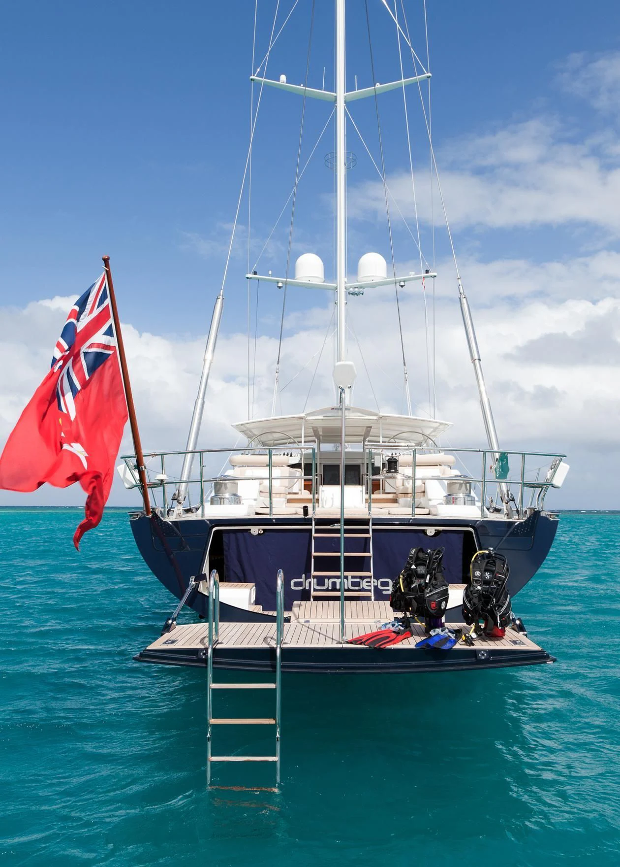 a boat with flags on it aboard GUILLEMOT Yacht for Sale