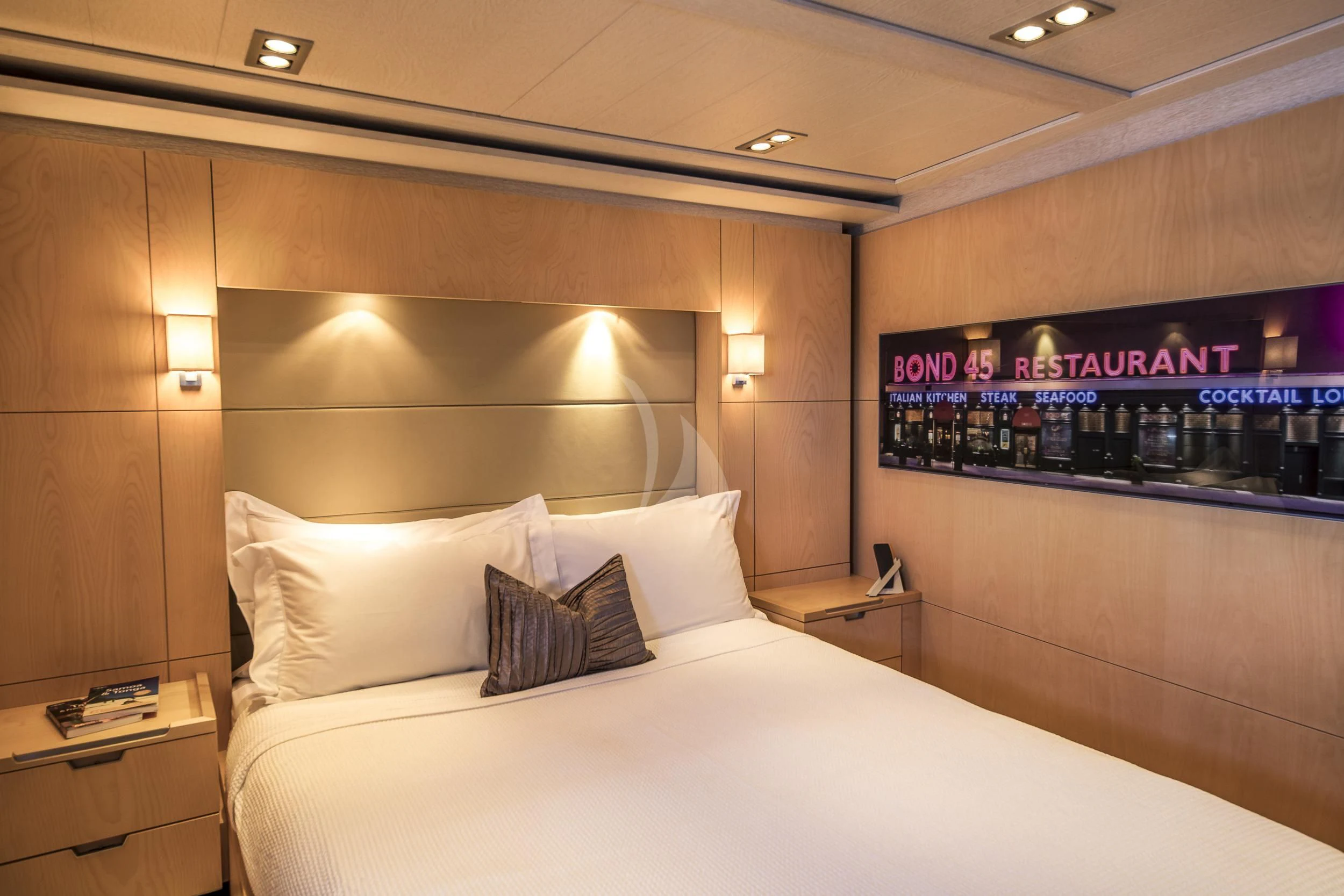 a hotel room with a bed and a television aboard GUILLEMOT Yacht for Sale