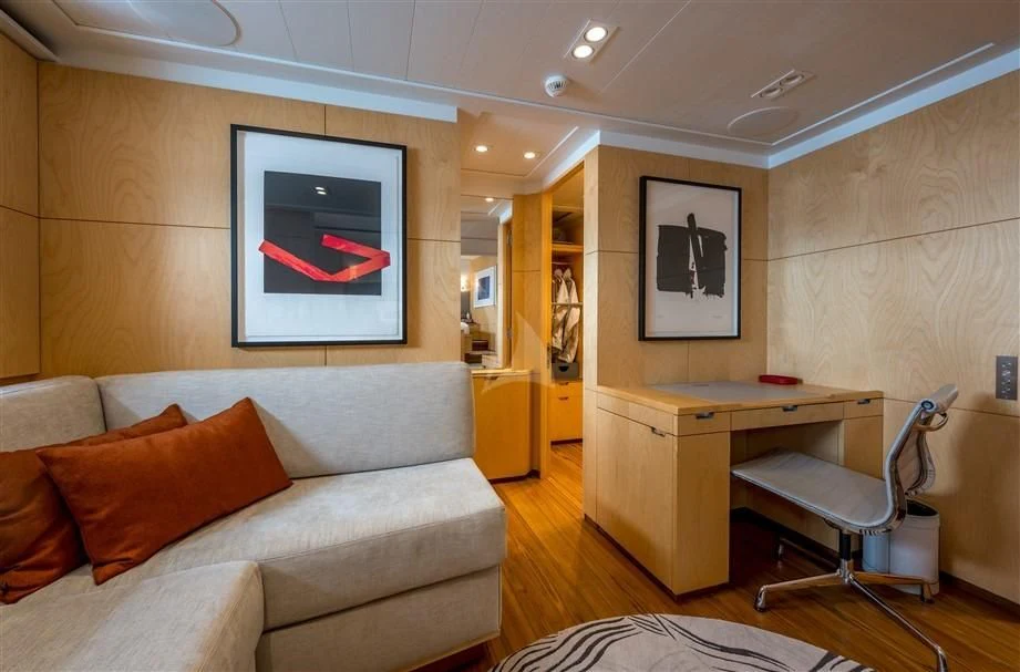 a living room with a couch and a desk aboard GUILLEMOT Yacht for Sale