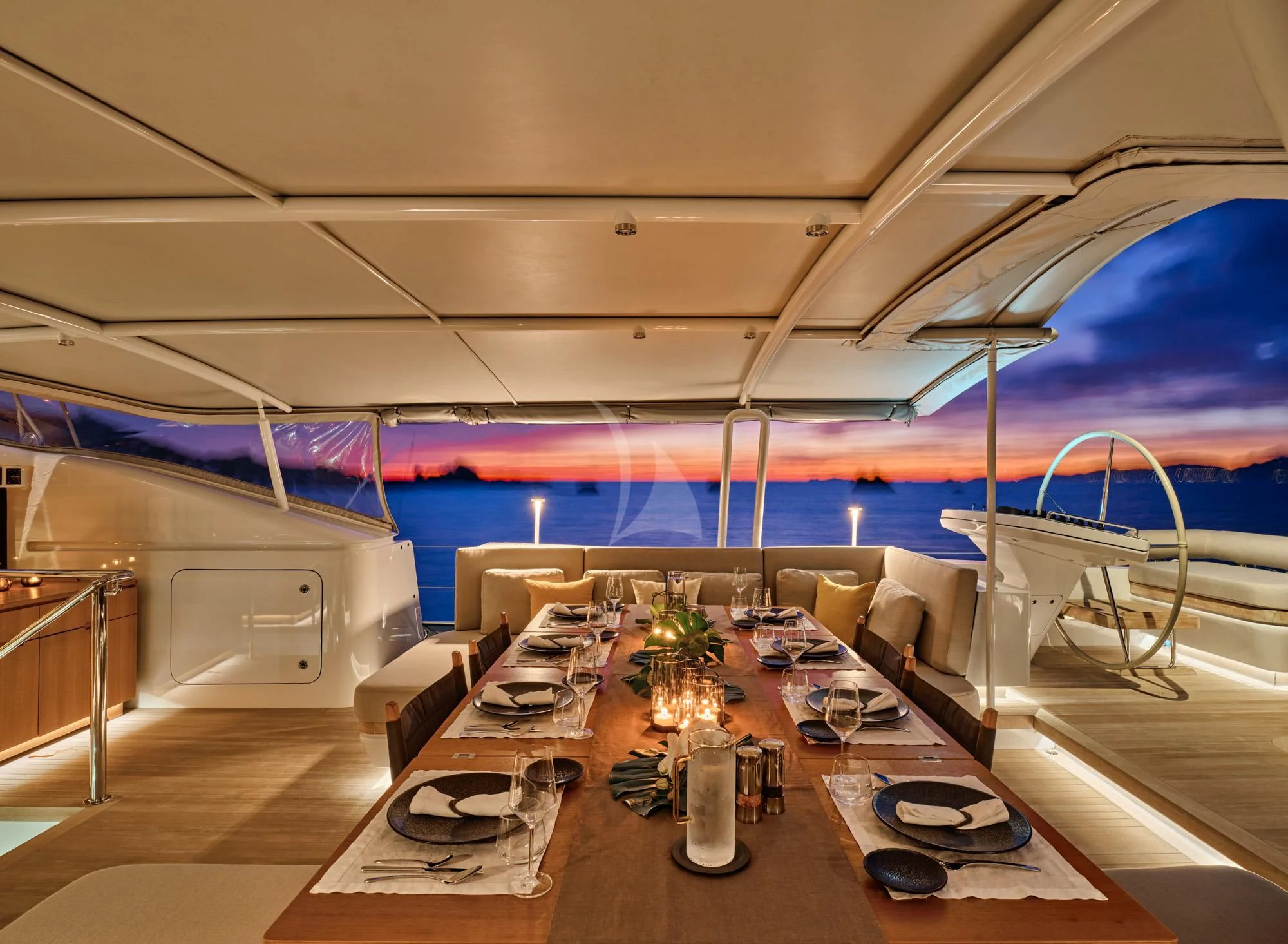 a room with tables and chairs aboard GUILLEMOT Yacht for Sale