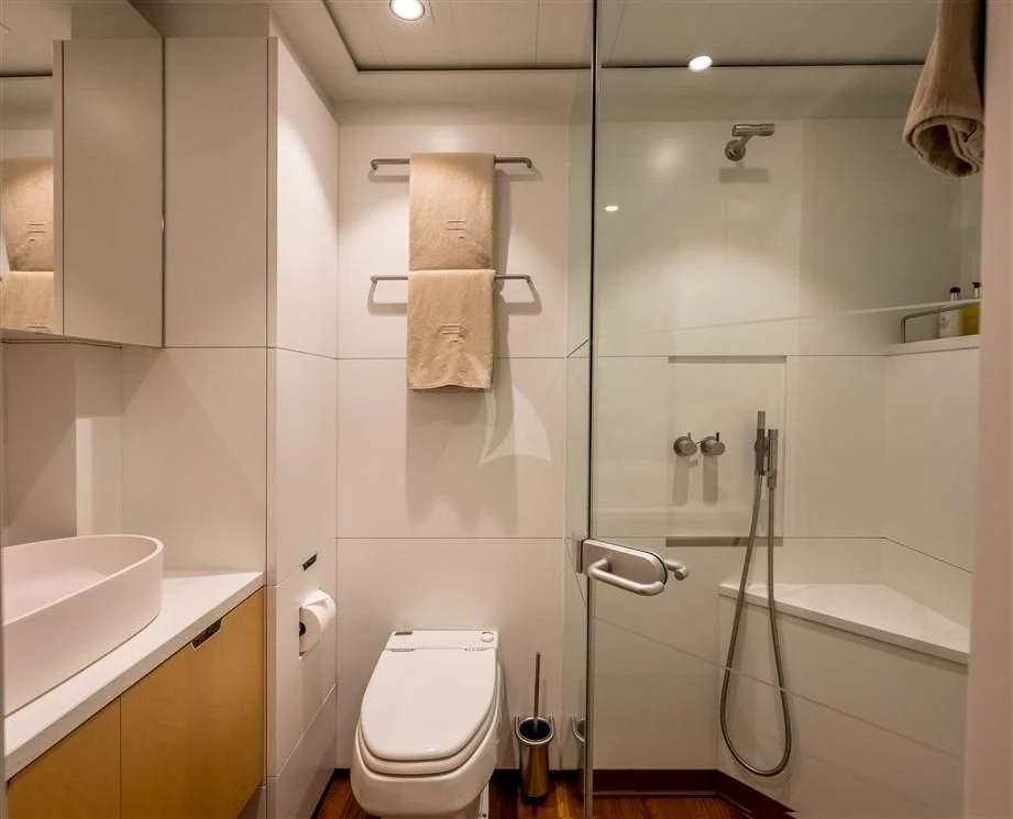 a bathroom with a shower and toilet aboard GUILLEMOT Yacht for Sale
