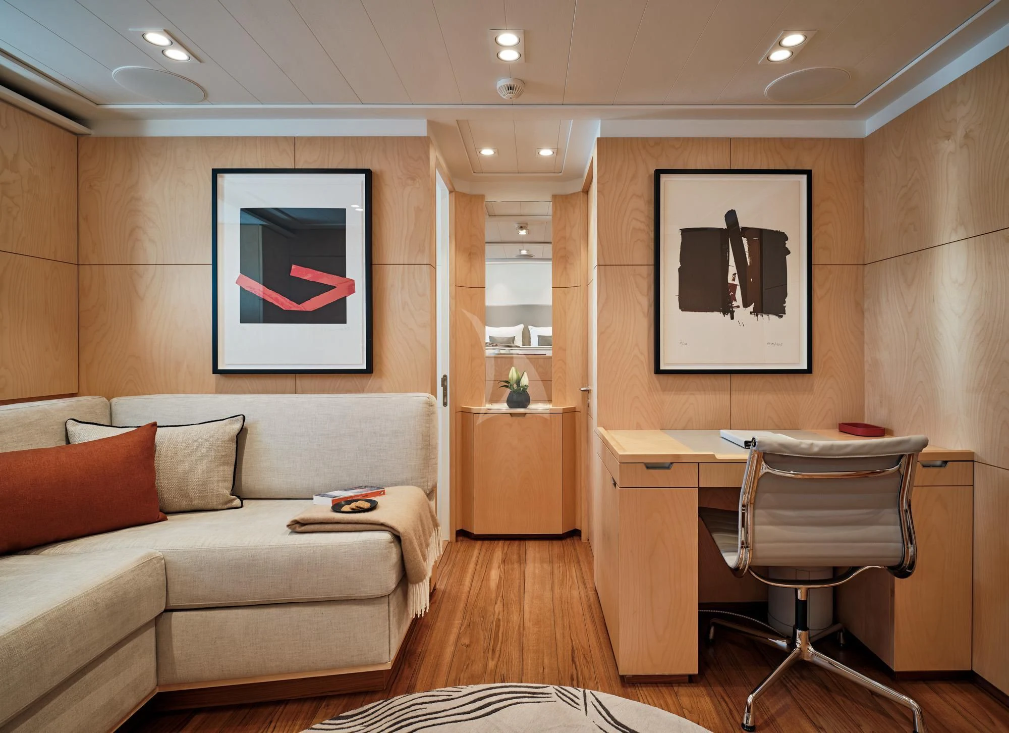 a living room with a couch and a table aboard GUILLEMOT Yacht for Sale
