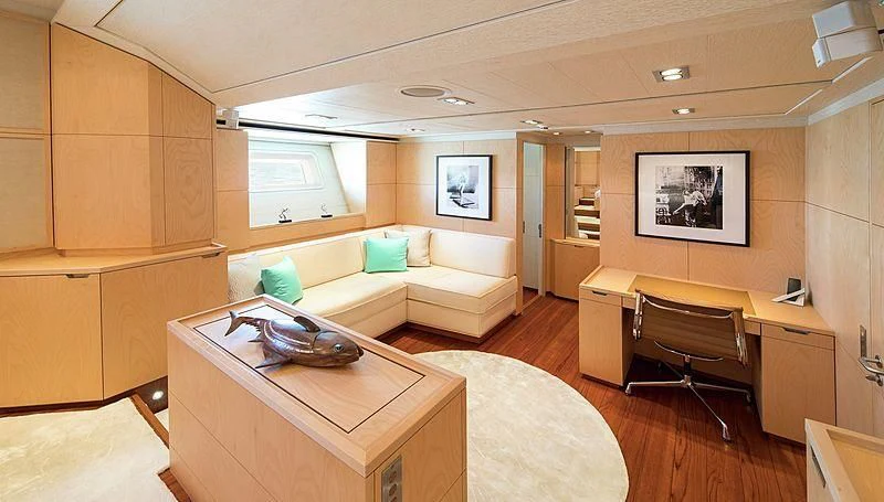 a room with a couch and a desk aboard GUILLEMOT Yacht for Sale