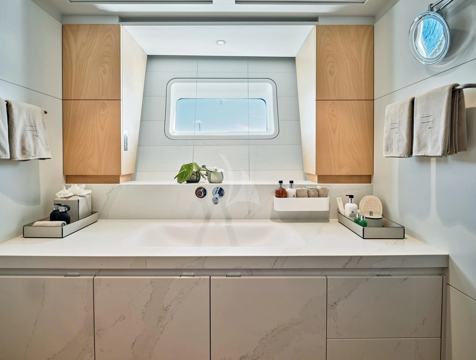 a bathroom with a sink and cabinets aboard GUILLEMOT Yacht for Sale
