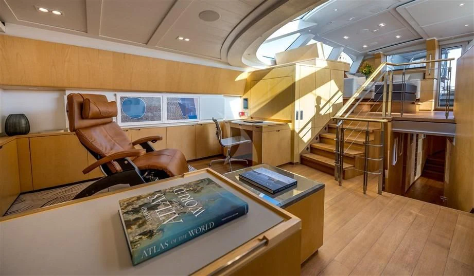 a room with a couch and a table and chairs aboard GUILLEMOT Yacht for Sale