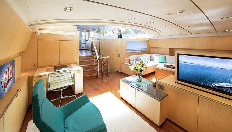 a room with a couch and a television aboard GUILLEMOT Yacht for Sale