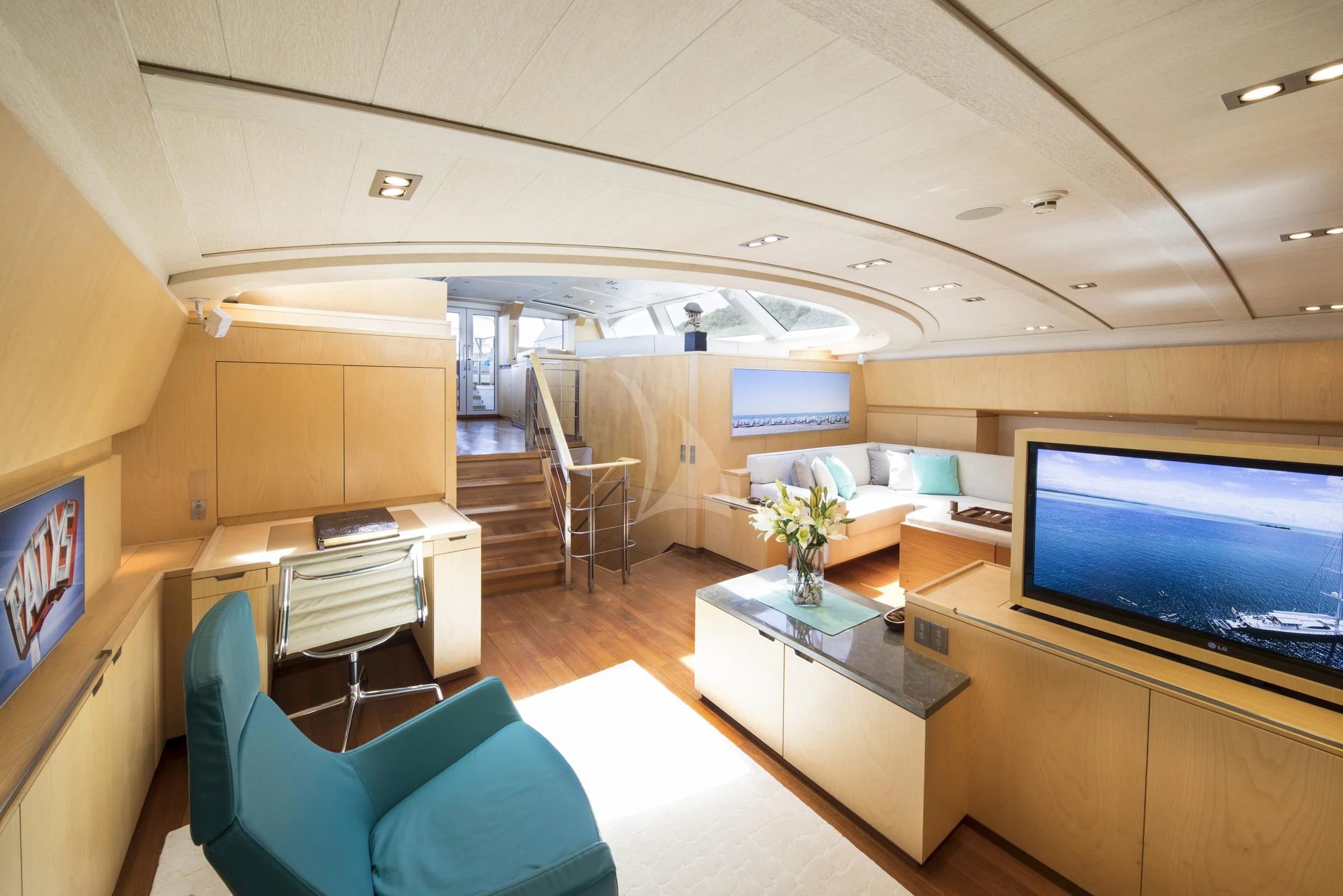 a room with a tv and a couch aboard GUILLEMOT Yacht for Sale