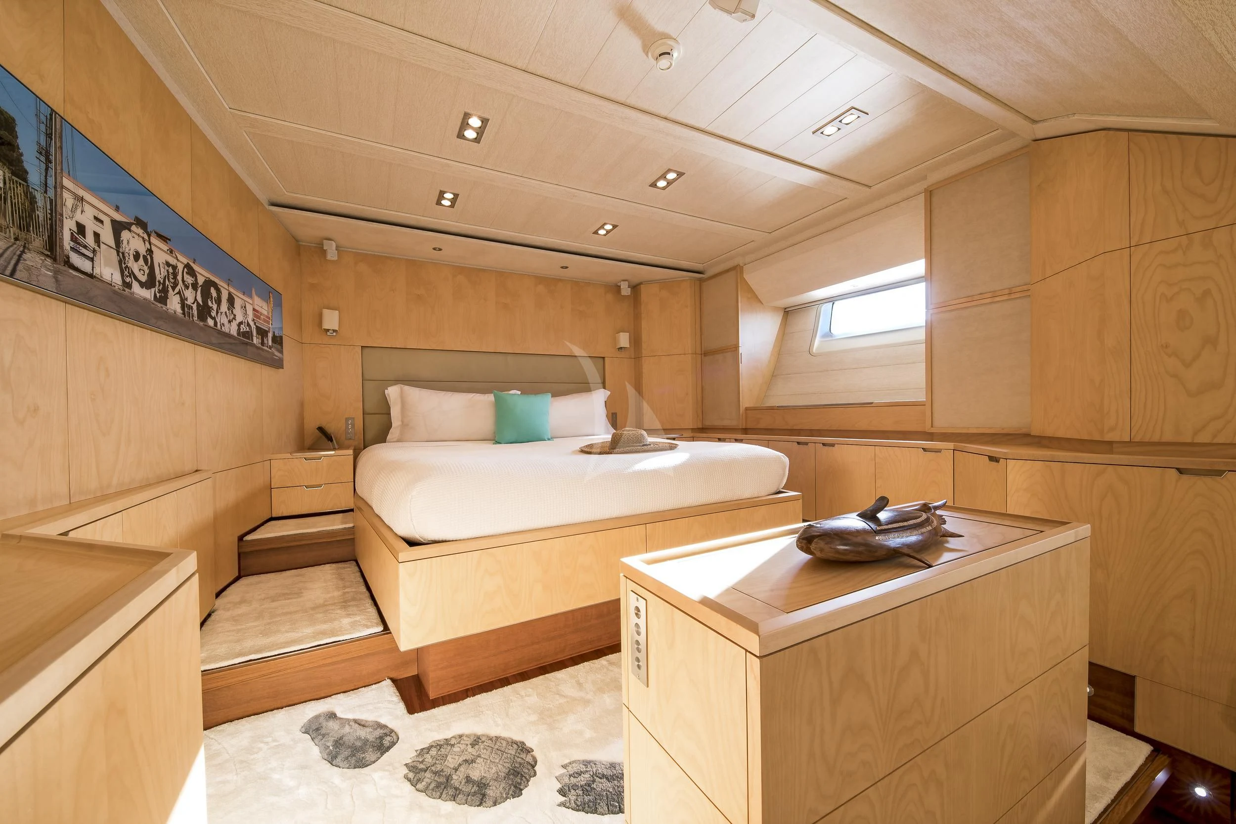 a room with a bed and a desk aboard GUILLEMOT Yacht for Sale